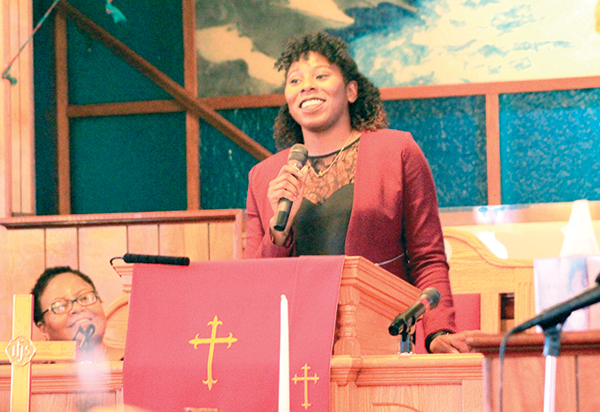 Air Force Capt. Tisha J. Yates was the guest speaker at the Mathews chapter of the NAACP’s annual Martin Luther King Jr. celebration, which was held on Sunday afternoon at Zion Baptist Church, Cardinal. Listening intently to Yates’s speech is Delphia Ferguson, who served as the mistress of ceremonies. Photo by Melany Slaughter