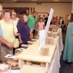 guinea cake auction bidding