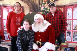 Jacob Salvio, 11, with parents Joe and Jami