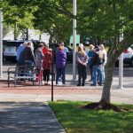 church praying at flagpole