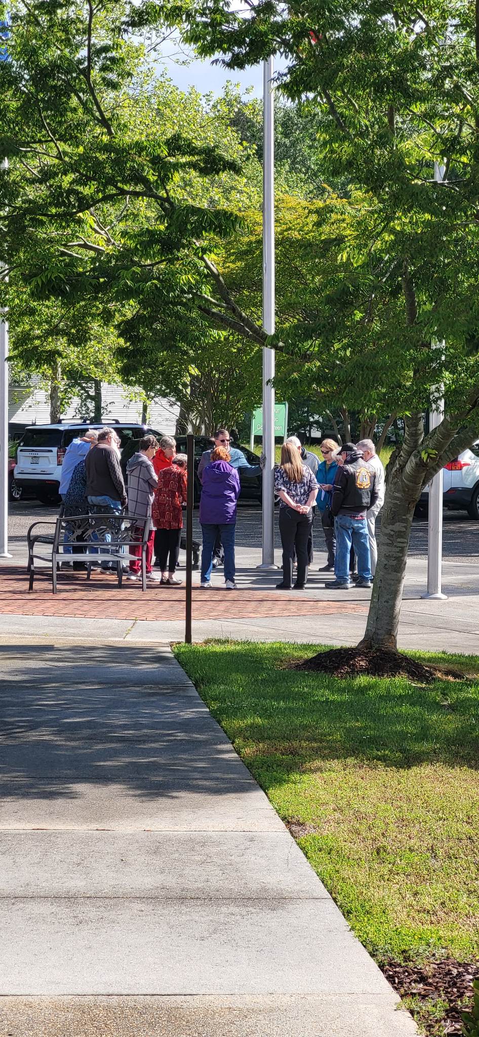 church praying at flagpole