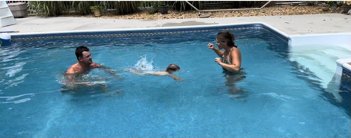 swim class kid and parents