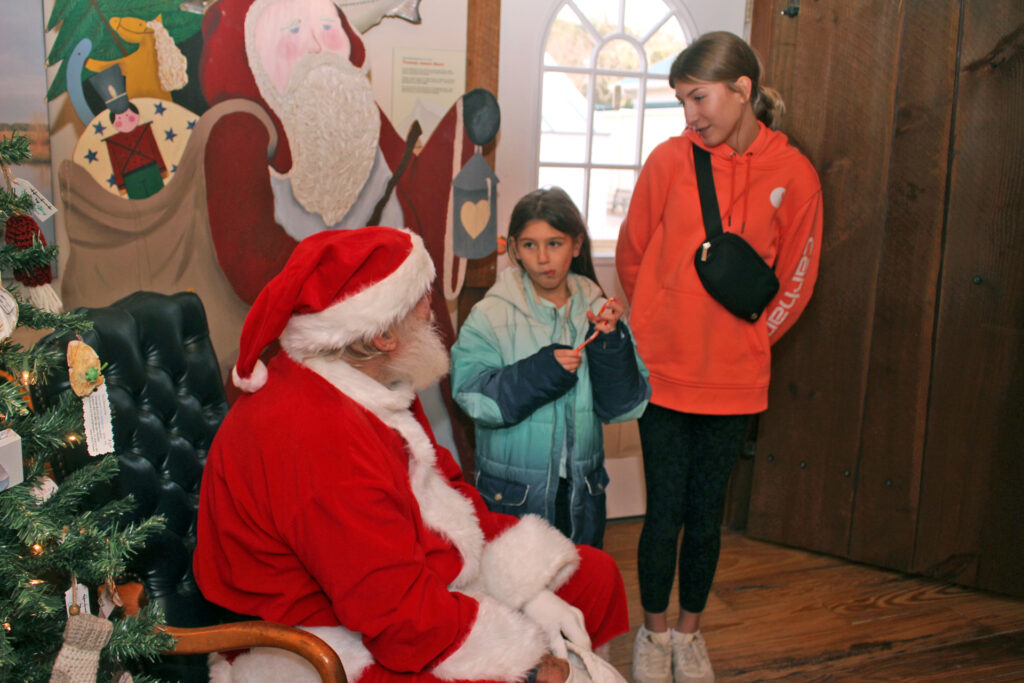 mathews santa Aubrey, 13, and Emma, 7, Adams