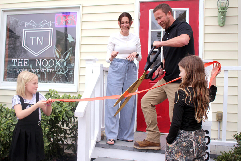 business ribbon cutting the nook