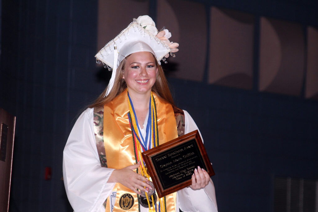 Grayson Griffith with General Excellence Award