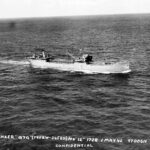 Aerial starboard side view of the vessel.